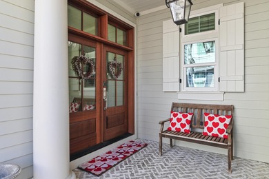 259 Moonlit Way is an exceptional Southerninspired residence on Regatta Bay Golf and Country Club in Florida - for sale on GolfHomes.com, golf home, golf lot