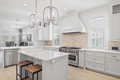 259 Moonlit Way is an exceptional Southerninspired residence on Regatta Bay Golf and Country Club in Florida - for sale on GolfHomes.com, golf home, golf lot