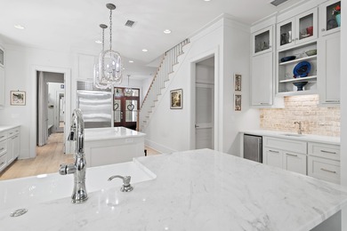 259 Moonlit Way is an exceptional Southerninspired residence on Regatta Bay Golf and Country Club in Florida - for sale on GolfHomes.com, golf home, golf lot