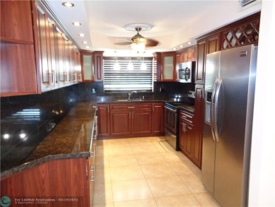 2/2 BEAUTIFUL WITH A LAKE VIEW ON THE FIRST FLOOR  UPDATE on Sunrise Lakes Phase III in Florida - for sale on GolfHomes.com, golf home, golf lot