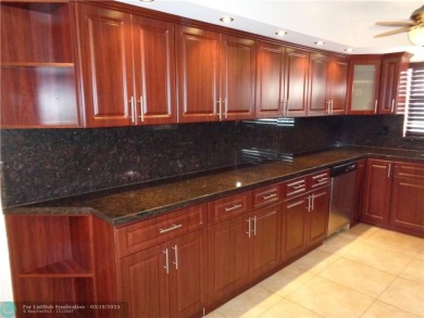 2/2 BEAUTIFUL WITH A LAKE VIEW ON THE FIRST FLOOR  UPDATE on Sunrise Lakes Phase III in Florida - for sale on GolfHomes.com, golf home, golf lot