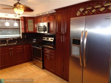 2/2 BEAUTIFUL WITH A LAKE VIEW ON THE FIRST FLOOR  UPDATE on Sunrise Lakes Phase III in Florida - for sale on GolfHomes.com, golf home, golf lot