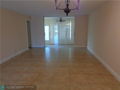 2/2 BEAUTIFUL WITH A LAKE VIEW ON THE FIRST FLOOR  UPDATE on Sunrise Lakes Phase III in Florida - for sale on GolfHomes.com, golf home, golf lot