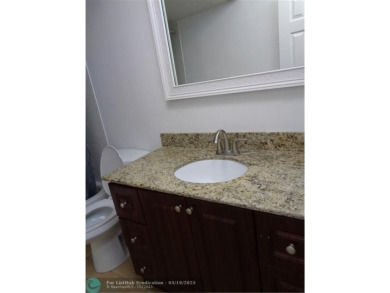2/2 BEAUTIFUL WITH A LAKE VIEW ON THE FIRST FLOOR  UPDATE on Sunrise Lakes Phase III in Florida - for sale on GolfHomes.com, golf home, golf lot