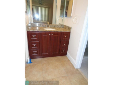 2/2 BEAUTIFUL WITH A LAKE VIEW ON THE FIRST FLOOR  UPDATE on Sunrise Lakes Phase III in Florida - for sale on GolfHomes.com, golf home, golf lot