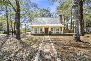 Welcome to this charming Creole cottage located near the Windsor on Lake Forest Yacht and Country Club in Alabama - for sale on GolfHomes.com, golf home, golf lot