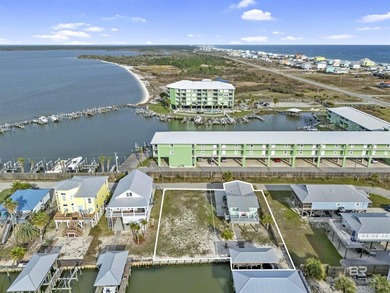 Beautiful, classic beach cottage on Mobile Bay with an on Kiva Dunes Golf Club in Alabama - for sale on GolfHomes.com, golf home, golf lot