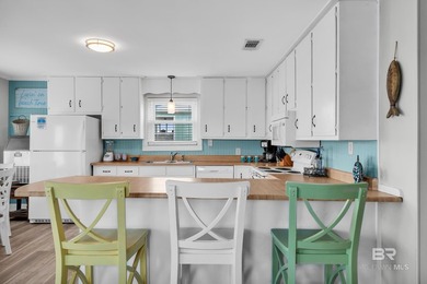 Beautiful, classic beach cottage on Mobile Bay with an on Kiva Dunes Golf Club in Alabama - for sale on GolfHomes.com, golf home, golf lot