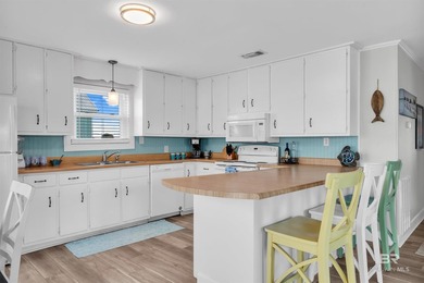 Beautiful, classic beach cottage on Mobile Bay with an on Kiva Dunes Golf Club in Alabama - for sale on GolfHomes.com, golf home, golf lot