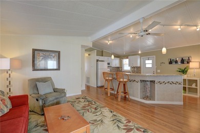 Fully furnished home located across from the golf course on Barefoot Bay Golf Course in Florida - for sale on GolfHomes.com, golf home, golf lot