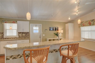 Fully furnished home located across from the golf course on Barefoot Bay Golf Course in Florida - for sale on GolfHomes.com, golf home, golf lot