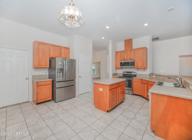 Welcome to this beautifully maintained Brick 4-bedroom on Golf Club At Fleming Island in Florida - for sale on GolfHomes.com, golf home, golf lot