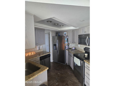 Escape to your own coastal sanctuary in this beautiful on Oceans Golf Club in Florida - for sale on GolfHomes.com, golf home, golf lot