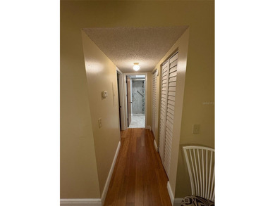 Step inside this condo and appreciate the bright, open floor on Tarpon Springs Golf Course in Florida - for sale on GolfHomes.com, golf home, golf lot