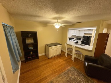 Step inside this condo and appreciate the bright, open floor on Tarpon Springs Golf Course in Florida - for sale on GolfHomes.com, golf home, golf lot