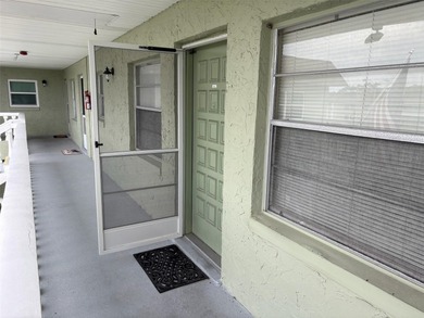 Step inside this condo and appreciate the bright, open floor on Tarpon Springs Golf Course in Florida - for sale on GolfHomes.com, golf home, golf lot