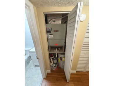 Step inside this condo and appreciate the bright, open floor on Tarpon Springs Golf Course in Florida - for sale on GolfHomes.com, golf home, golf lot