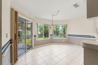 Welcome to this well maintained 2-bedroom, 2-bathroom on Oak Hills Country Club in Florida - for sale on GolfHomes.com, golf home, golf lot