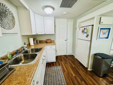 2 BED/2 BATH BEACH HOUSE IN OCEAN LAKES WITH WRAPAROUND COVERED on Prestwick Country Club in South Carolina - for sale on GolfHomes.com, golf home, golf lot
