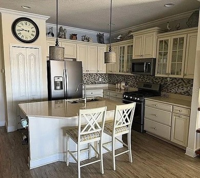 Step into effortless Florida living with this pristine, turnkey on Boca Royale Golf and Country Club in Florida - for sale on GolfHomes.com, golf home, golf lot