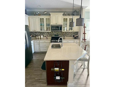 Step into effortless Florida living with this pristine, turnkey on Boca Royale Golf and Country Club in Florida - for sale on GolfHomes.com, golf home, golf lot