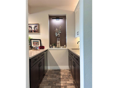 This beautifully designed home, loaded with premium upgrades on Wildhorse Golf Club of Robson Ranch in Texas - for sale on GolfHomes.com, golf home, golf lot