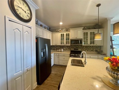 Step into effortless Florida living with this pristine, turnkey on Boca Royale Golf and Country Club in Florida - for sale on GolfHomes.com, golf home, golf lot