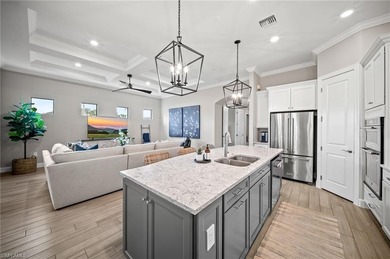 Built in 2022, this light-filled *Summerwood* floorplan home on Calusa Pines Golf Club in Florida - for sale on GolfHomes.com, golf home, golf lot