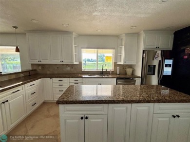 Stunning 4-Bedroom, 4-Bathroom Home on Coral Springs Country on Country Club of Coral Springs in Florida - for sale on GolfHomes.com, golf home, golf lot