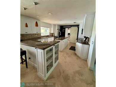 Stunning 4-Bedroom, 4-Bathroom Home on Coral Springs Country on Country Club of Coral Springs in Florida - for sale on GolfHomes.com, golf home, golf lot