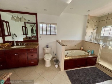 Stunning 4-Bedroom, 4-Bathroom Home on Coral Springs Country on Country Club of Coral Springs in Florida - for sale on GolfHomes.com, golf home, golf lot