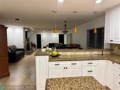 Stunning 4-Bedroom, 4-Bathroom Home on Coral Springs Country on Country Club of Coral Springs in Florida - for sale on GolfHomes.com, golf home, golf lot