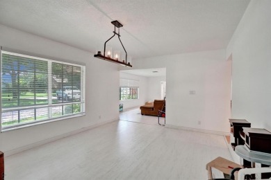 Stunning 4-Bedroom, 4-Bathroom Home on Coral Springs Country on Country Club of Coral Springs in Florida - for sale on GolfHomes.com, golf home, golf lot
