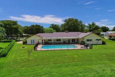Stunning 4-Bedroom, 4-Bathroom Home on Coral Springs Country on Country Club of Coral Springs in Florida - for sale on GolfHomes.com, golf home, golf lot
