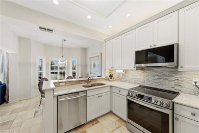 Rarely available and beautifully updated 2nd floor coach home in on The Colony Golf and Country Club in Florida - for sale on GolfHomes.com, golf home, golf lot