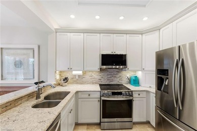 Rarely available and beautifully updated 2nd floor coach home in on The Colony Golf and Country Club in Florida - for sale on GolfHomes.com, golf home, golf lot