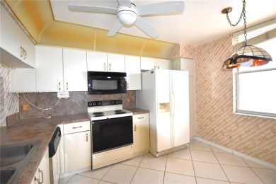 Spacious 2-bedroom 2 bath condo offers a good size kitchen with on Sunrise Lakes Phase IV Golf Course in Florida - for sale on GolfHomes.com, golf home, golf lot