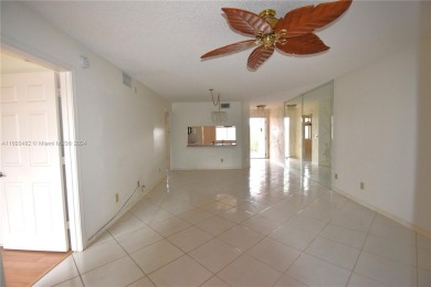 Spacious 2-bedroom 2 bath condo offers a good size kitchen with on Sunrise Lakes Phase IV Golf Course in Florida - for sale on GolfHomes.com, golf home, golf lot