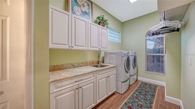 Set on a serene cul-de-sac within the prestigious Laurel Oak on Laurel Oak Country Club in Florida - for sale on GolfHomes.com, golf home, golf lot