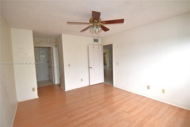 Spacious 2-bedroom 2 bath condo offers a good size kitchen with on Sunrise Lakes Phase IV Golf Course in Florida - for sale on GolfHomes.com, golf home, golf lot