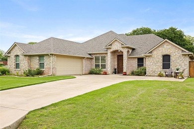 Beautiful, well maintained home built in 2015 is well placed on Pecan Plantation Country Club in Texas - for sale on GolfHomes.com, golf home, golf lot