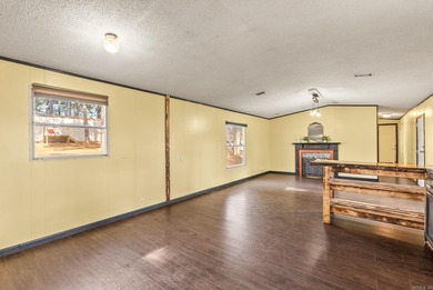 GREAT CONDITION + AFFORDABLE! You'll love being by the lake! on Mountain Ranch Golf Club in Arkansas - for sale on GolfHomes.com, golf home, golf lot