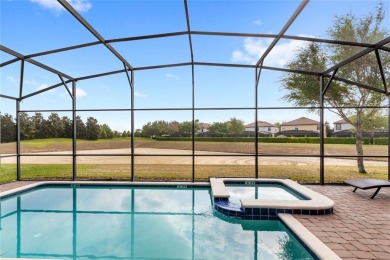 This VACATION HOME CHECKS ALL THE BOXES YOU'VE BEEN LOOKING FOR! on The Oasis Club at Champions Gate in Florida - for sale on GolfHomes.com, golf home, golf lot