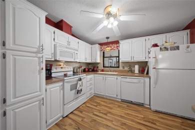 Nestled in the well-established Village of ORANGE BLOSSOM on Orange Blossom Hills Golf and Country Club in Florida - for sale on GolfHomes.com, golf home, golf lot