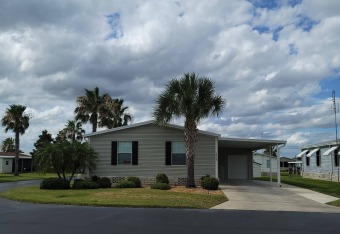 Whispering Pines Community:  In this community, you are outside on Lily Lake Golf & RV Resort in Florida - for sale on GolfHomes.com, golf home, golf lot