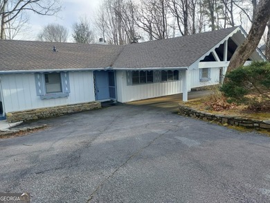 This adorable 4-bedroom, 4.5-bathroom mountain cabin is located on Sky Valley Resort and Country Club in Georgia - for sale on GolfHomes.com, golf home, golf lot