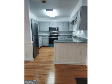 This adorable 4-bedroom, 4.5-bathroom mountain cabin is located on Sky Valley Resort and Country Club in Georgia - for sale on GolfHomes.com, golf home, golf lot