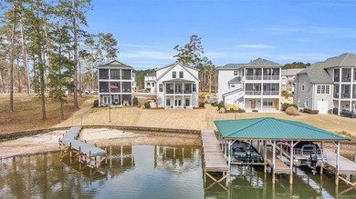 Imagine waking up every day in a lakefront home, sipping your on The Patriot Golf Club At Grand Harbor in South Carolina - for sale on GolfHomes.com, golf home, golf lot