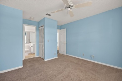Welcome to this charming single-story home in the gated Barclay on PGA National Golf Club in Florida - for sale on GolfHomes.com, golf home, golf lot