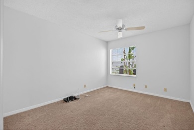 Welcome to this charming single-story home in the gated Barclay on PGA National Golf Club in Florida - for sale on GolfHomes.com, golf home, golf lot